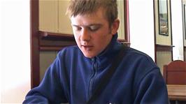 Gavin enjoys a late breakfast in the cafe at Myrdal station while we wait for our next train